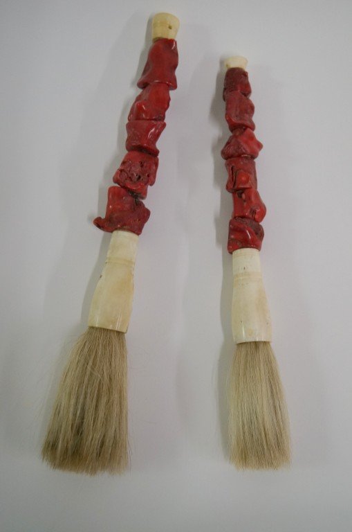 Two(2) Chinese calligraphy brushes: Carved coral, bone and horsehair; 13in. L.