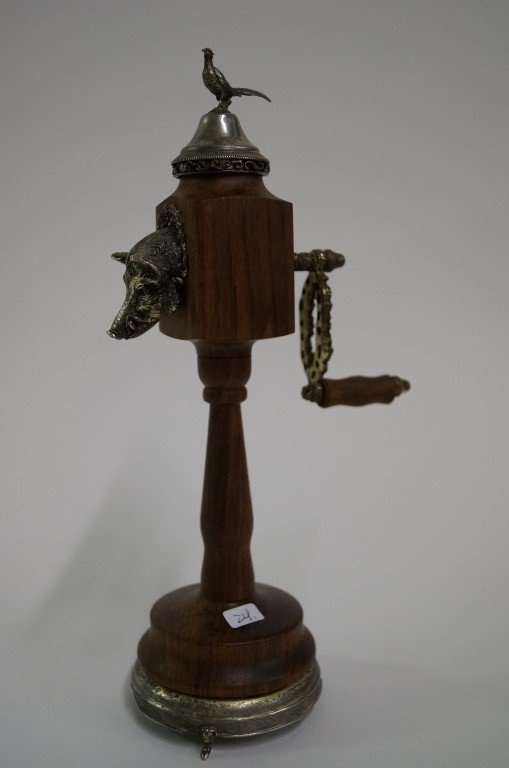 European Silver Mounted Pepper Mill: Figural Boar Head Dispenser of the pepper after it is ground. Raised on a tri-footed base. Pheasant finial to the top; 11in. H.