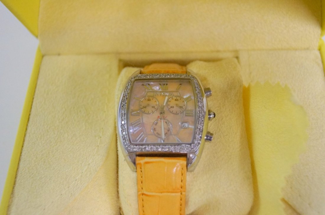 Invicta Angel ladie's watch: Ladie's quartz chronograph watch. Stainless steel, mother of pearl face, and diamond bezel. Leather strap. 39mm