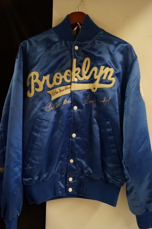 Brooklyn Dodgers jacket signed: Brooklyn Dodgers jacket signed by Sandy Koufax, Pee Wee Reese at Trump Plaza 1991 show. Accompanied by certificate from Big League Marketing Inc. by Fran Davies, 4-13-13