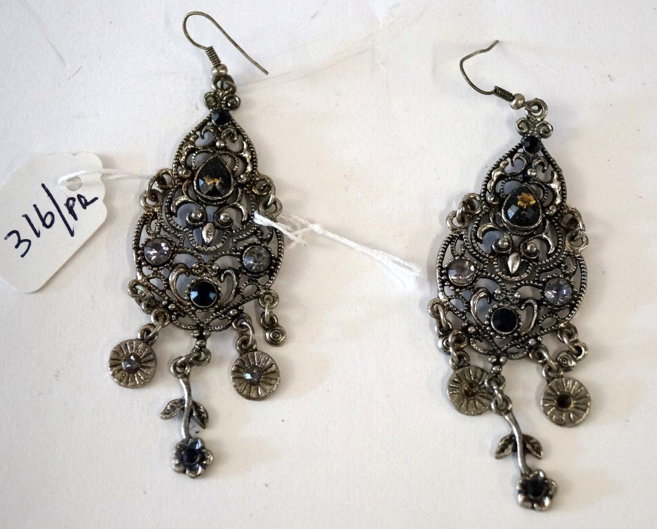 Pair of Tibetan silver earrings: Pair of elaborate silver pierced earrings. Various stones including paste, gold dust, etc.; 3in. Drop