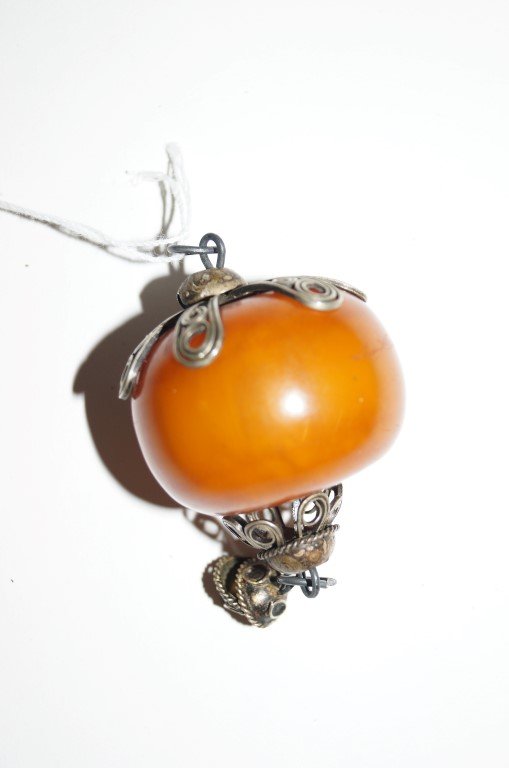 Silver Mounted Carnelian Pendant: Large carnelian pendant mounted in filigreed silver. With loop for wearing; 3.25in. Drop