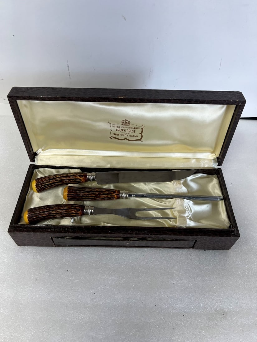 Crown Crest Carving Set 3 Pc.: Fork, knife and skewer with horn and bone handles. In original box.