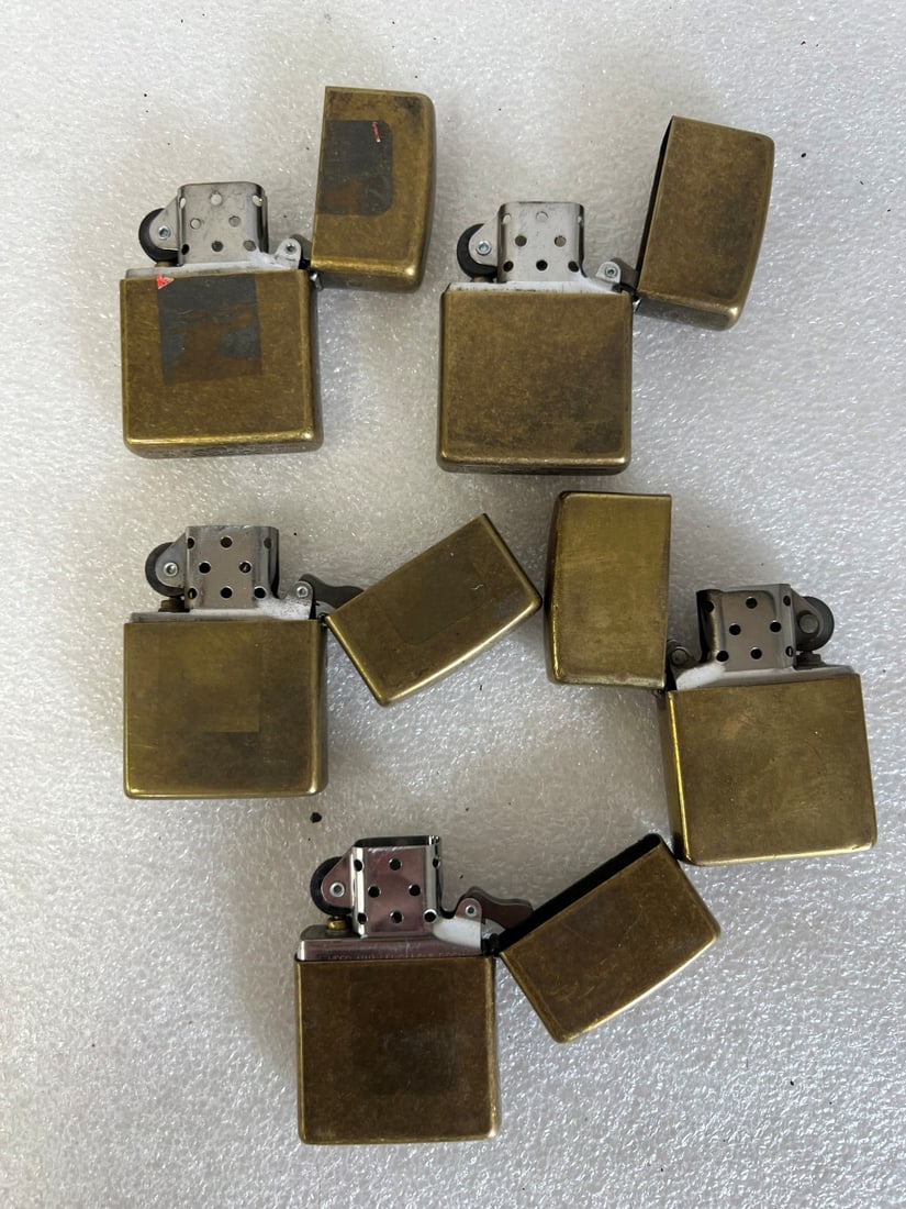 Vintage Brass Lighters Marked (5): Five in the lot. All marked but indiscernibly. All 2 1/4 "H x 1 1/4"W