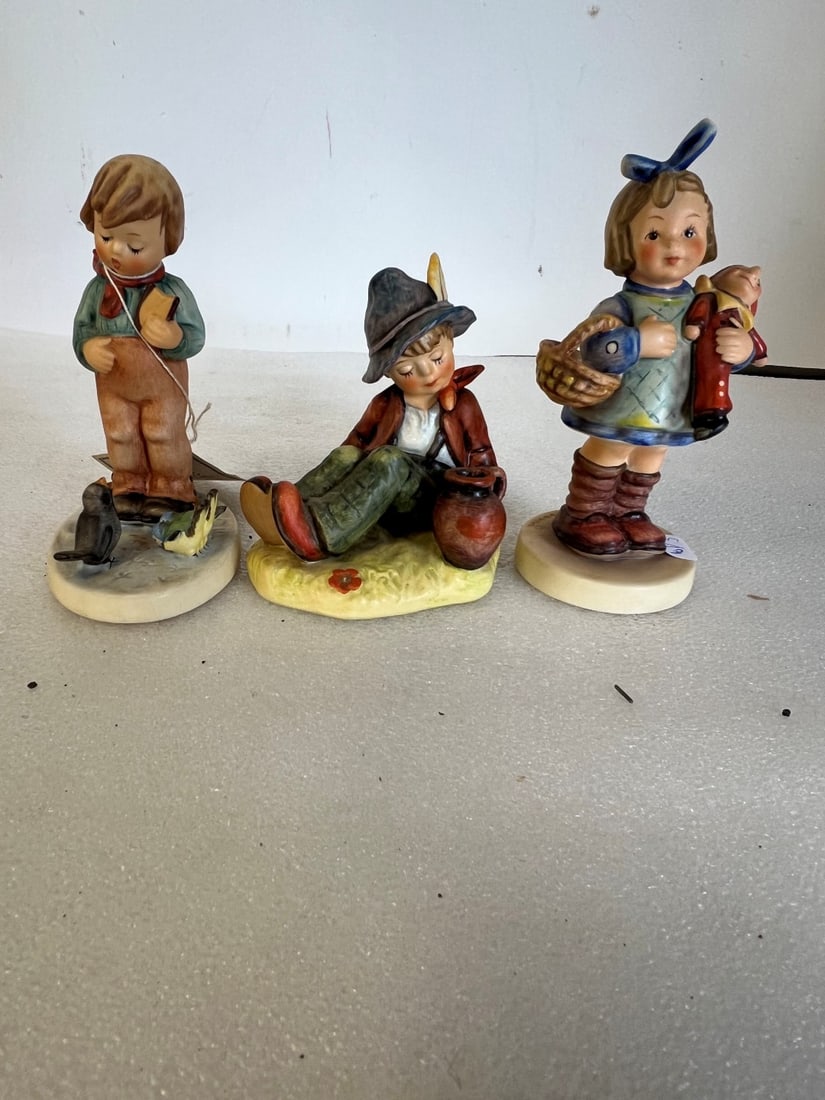 Hummel Figurines (3): All marked. As pictured. This lot includes "Bird Watcher Tierfreund", "Coffee Break" and "What now?". Tallest is 5.75"H and smallest is 4"H.