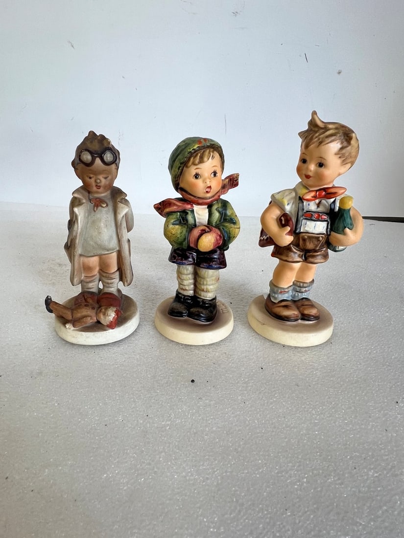 Hummel Figurines (3): All marked. As pictured. Lot includes "Doctor", "Its Cold" and "Valentine Joy". Tallest is 5.5"H and smallest is 5"H.