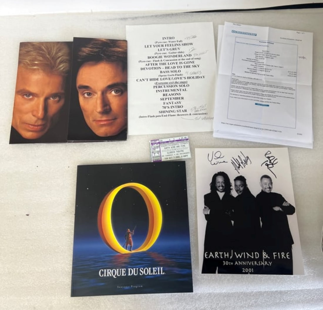 Cirque Du Soleil Program & Second- Earth Wind & Fire Ticket & Sgd. Photograph: Second program is Siegfried and Roy at the Mirage. Signed Maurice White, Philip Bailey and Verdine White. Dated 2001 30th Anniversary. Four items in the lot.