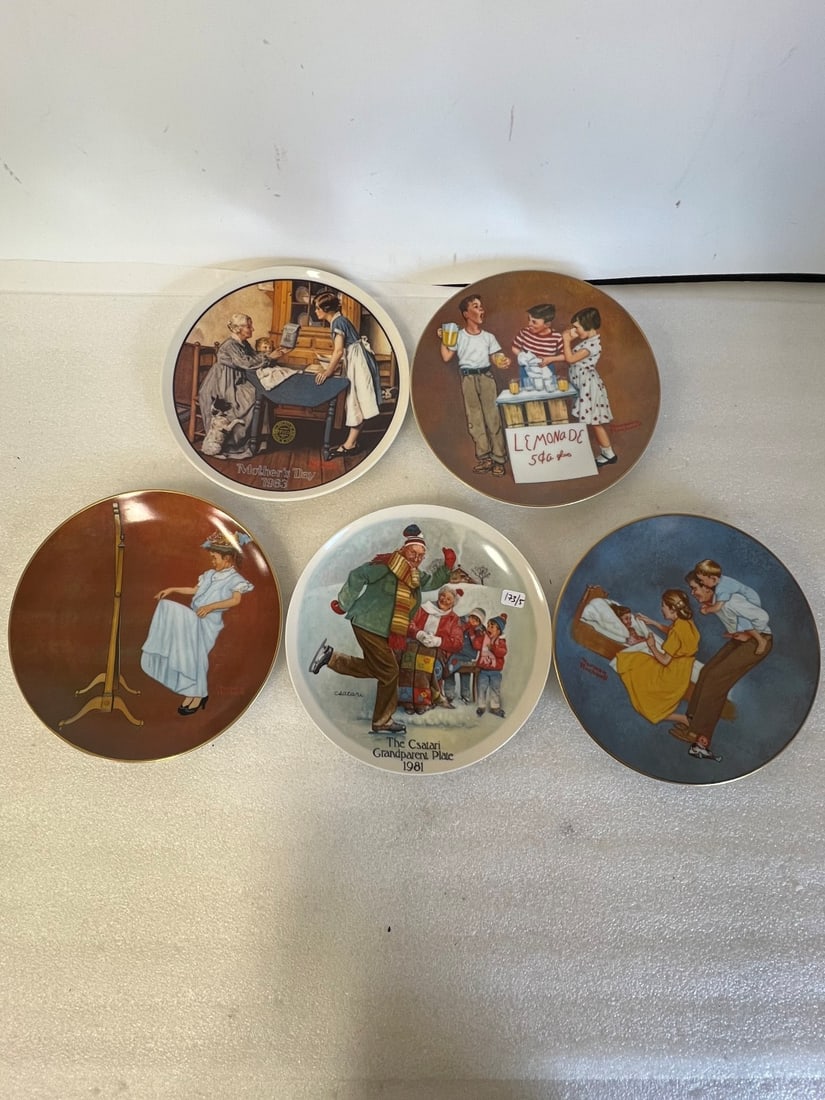Rockwell Collectors Plates (4) and 1 other: 3 American Family Series II by Norman Rockwell. Includes "Little Salesman", "Sweet Dreams" and "Almost Grown Up". A mothers day plate titled "Add Two Cups And A Measure Of Love". And a Joseph Csatari 