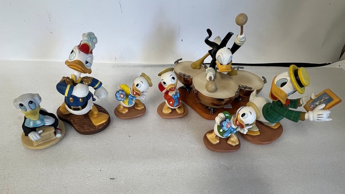 Collectible Disney Figures (7): Donald Duck, 1994 Members Only Figure, Sea Scouts, Admiral Duck; Symphony Hour, Drum Beat; Mr. Duck Steps Out, (One large and 3 Small) and one small without name Seven in the lot.