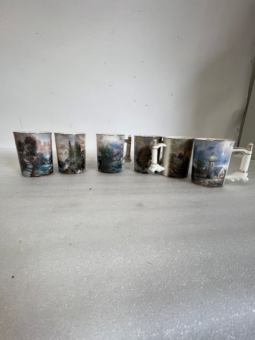 Thomas Kinkade's Seaside Inspiration Mugs 6: Six in the lot. All with elaborate entitlement and information at the underside. All marked Thomas Kinkade in gold at the inside as well.4 /4'H