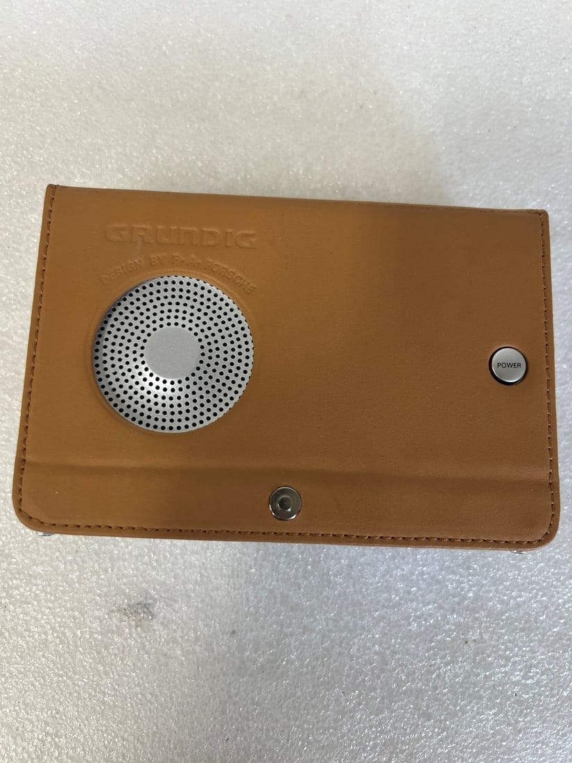 Grundig Radio. Design by F. A. Porsche: In original case. Appears new.