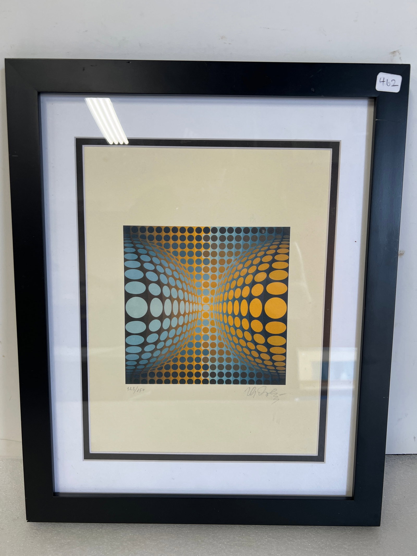 Victor Vasarely Lithograph Sgd: (Hungarian 1906-1997) Pencil signed lithograph of a blue and yellow sphere in an optical pattern , numbered 123/150 on heavy weight paper, 15 1/2? for height by 12 1/2? across