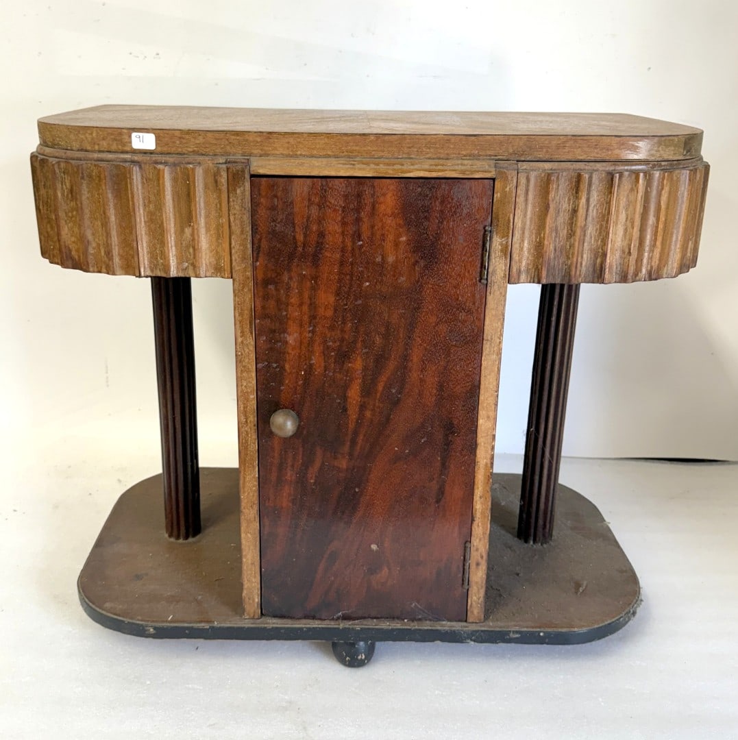 Art Deco Nightstand: Carved and scalloped mahogany nightstand. One door; 21in.H. x 24in.W. x 12in.D.
