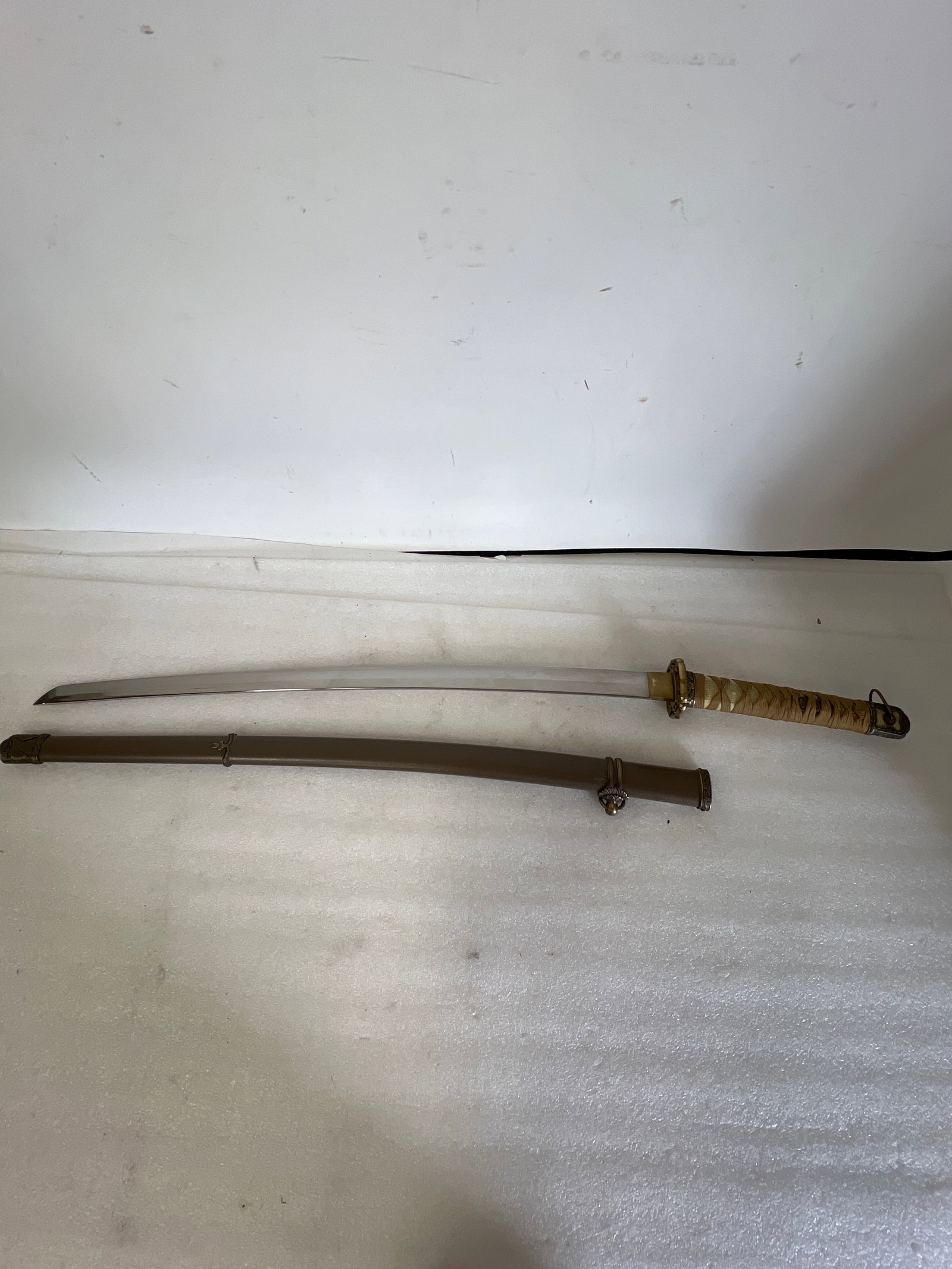 WWII Japanese NCO Sword: As pictured. 38.5”L. Featuring detailed brass guard.