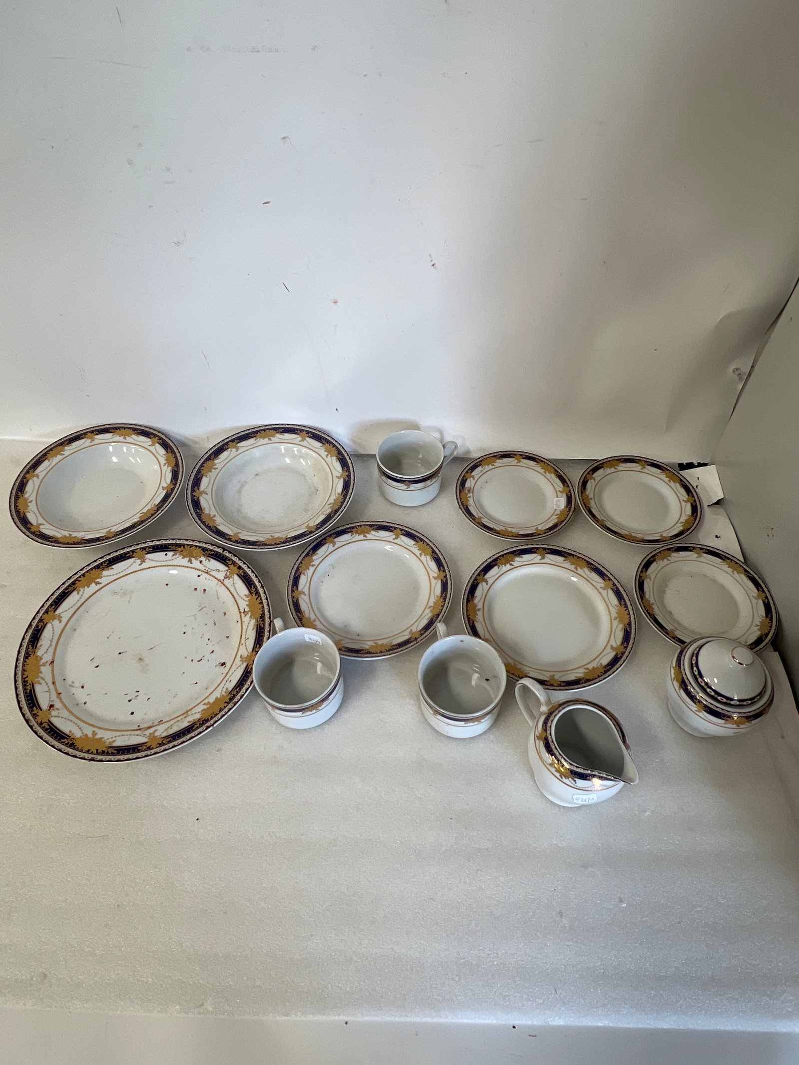 Royal Scotland China Partial Service(13): All marked at the underside. Lot includes: 1 sugar bowl and creamer, 3 tea cups with saucers, 2 dessert plates, 1 dinner plate, and 2 soup bowls. As pictured
