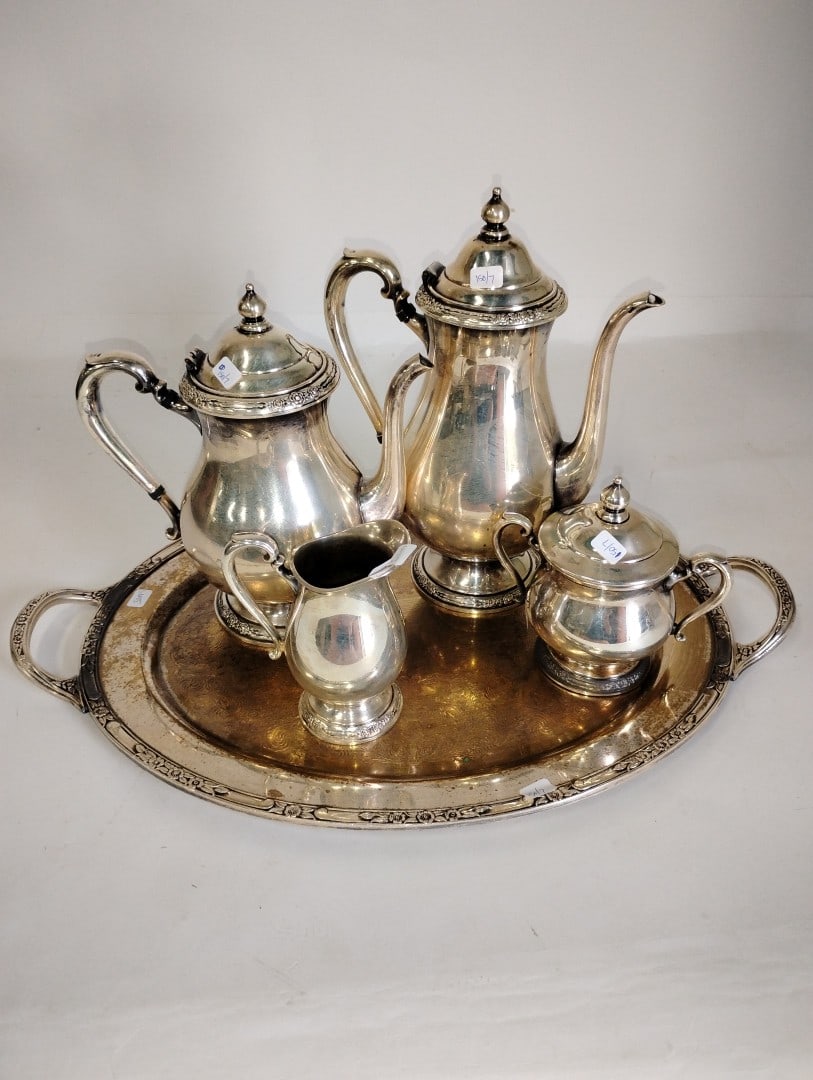 Camille International Silver Co Tea and Coffee Service: Coffee Pot, teapot, creamer and sugar on tray Tray is not marked. Included in the lot is an Oneida sugar and a pr. o f sugar tongs (EPNS) Seven items in the lot