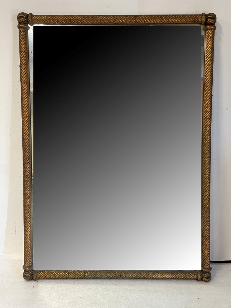 Louis XVI Style Gilt Framed Wall Mirror: Heavy gilt framed wall mirror. Twisted rope design; 35.5in. x 25.25in.