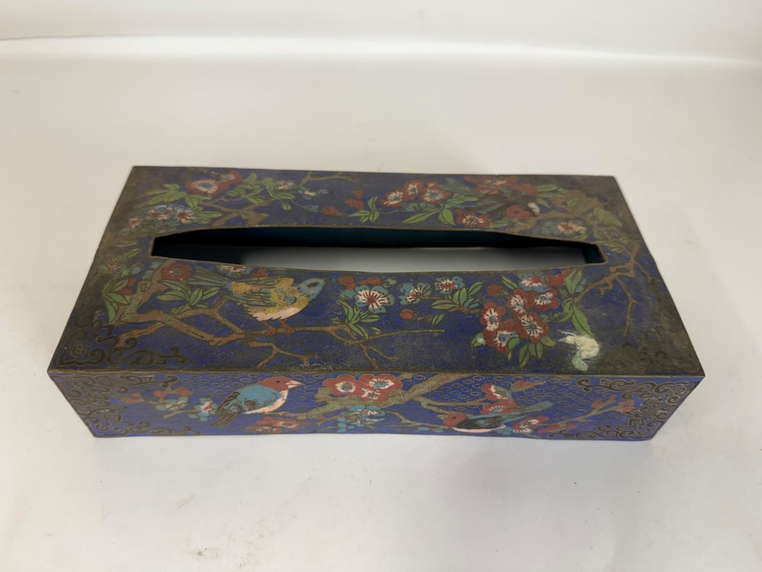 Chinese Cloisonne Enameled Tissue Box Cover: Enameled tissue box cover. Decorated with birds amongst flora and foliage; 2.25in.H. x 10in.W. x 5in.D.