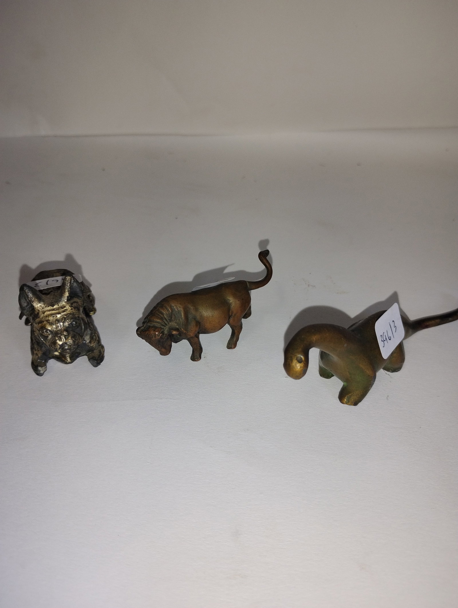 Antique Bronze Miniatures (3): A dinosaur, a cow and a pitbull. Longest is 4.25".