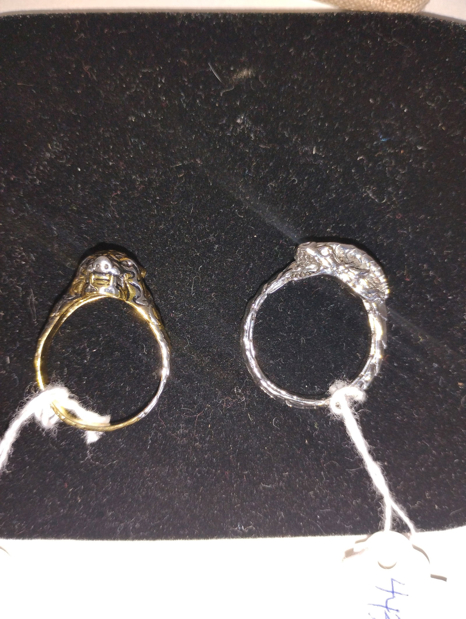 Sterling Silver Rings (2): One a snake eating its tail , sterling silver and one a leopard head sterling and gilt