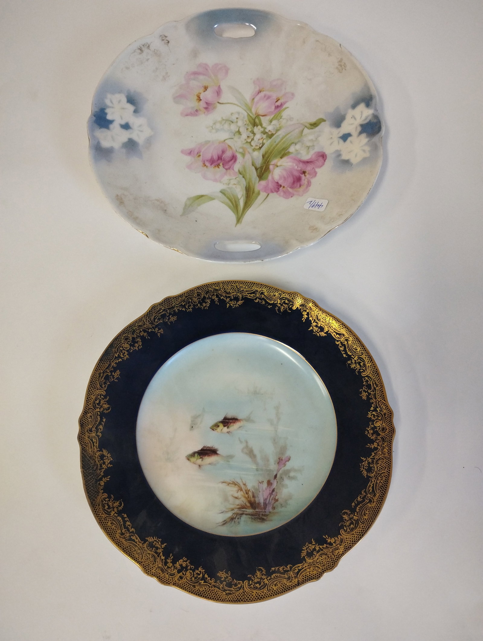 Limoges Fish Plate and German Floral Platter: Cobalt and gilt hand painted fish platter marked Theo Haviland Limoges for Higgins and Seiter NY and a German hand Painted floral decorated platter. 9" and 10: