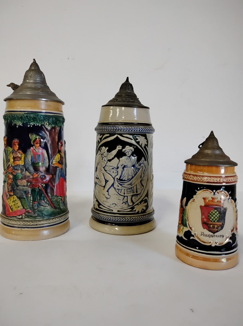 Vintage German Beer Steins(3): Smallest is 6.5"H. Tallest is 10.75"H. All marked "made in Germany" at the underside