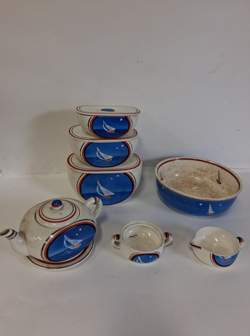 Sailing Boat Themed Porcelain (8): Teapot, several different sized bowls, a double handled sugar bowl , a creamer etc. Eight pcs in the lot Various sizes