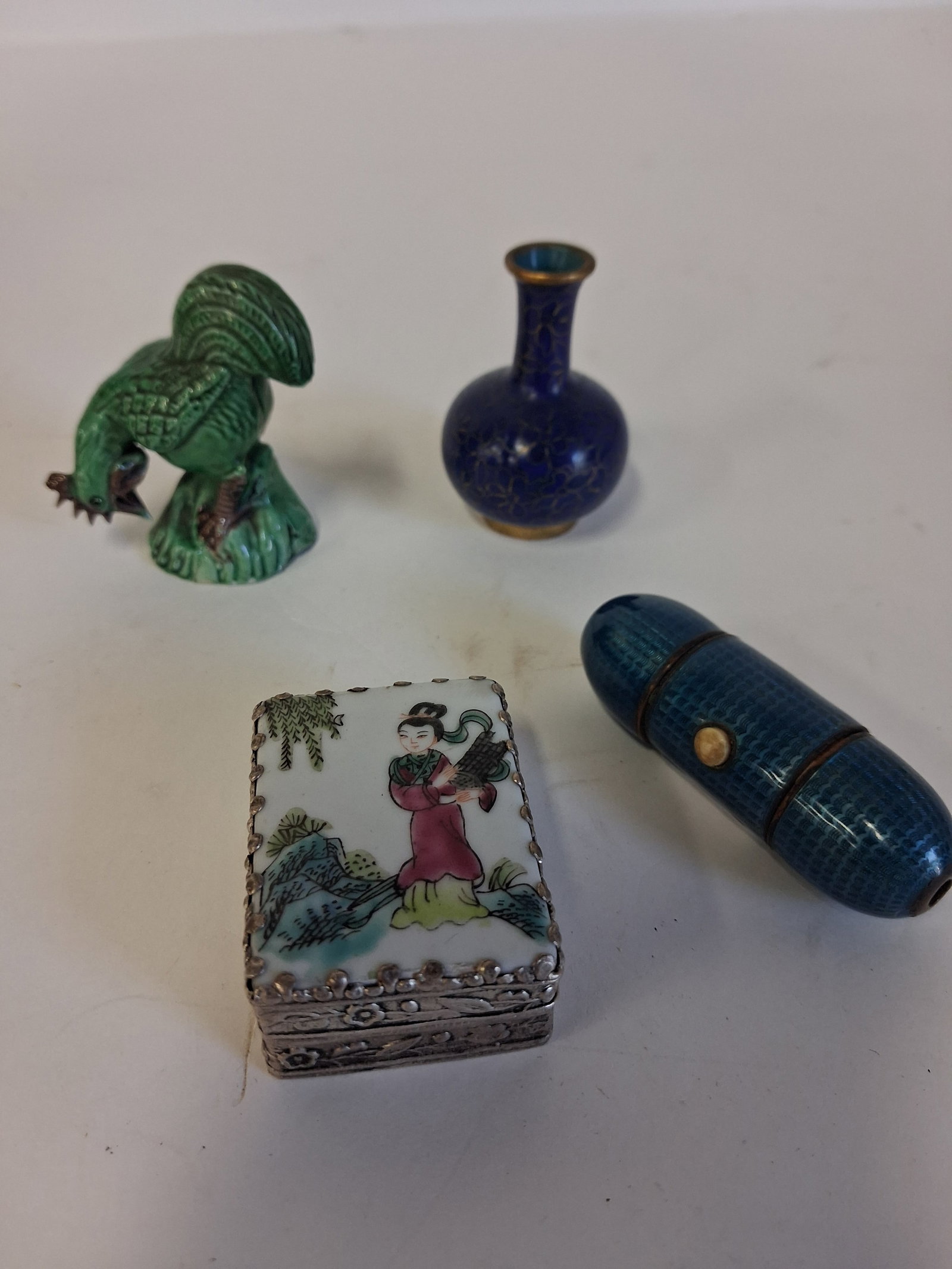 Lot of Antique Oriental Collectibles (4): Covered Mirrored Box, porcelain scene at top 1 7/8" x 1 1/2"; a miniature cloisonne vase 2 1/4", a pottery rooster figure 2 1/2"and an enameled tubular blue three part box. Four items in the lot