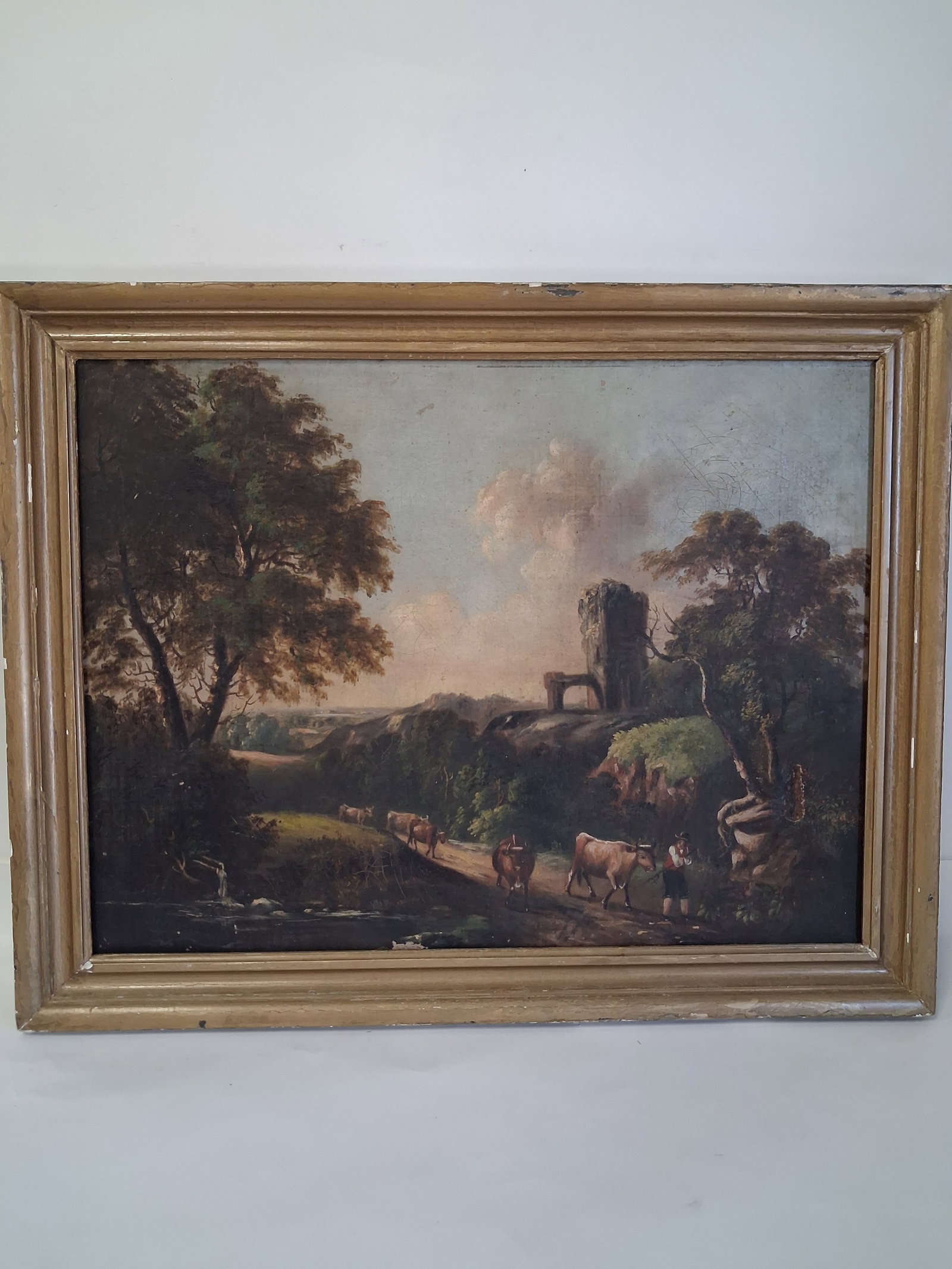 19th C. Continental Oil on Canvas: British Continental School, minor imperfection as pictured. Pastoral Landscape with cattle and ruins. 21 3/8”H by 27 1/8”W.