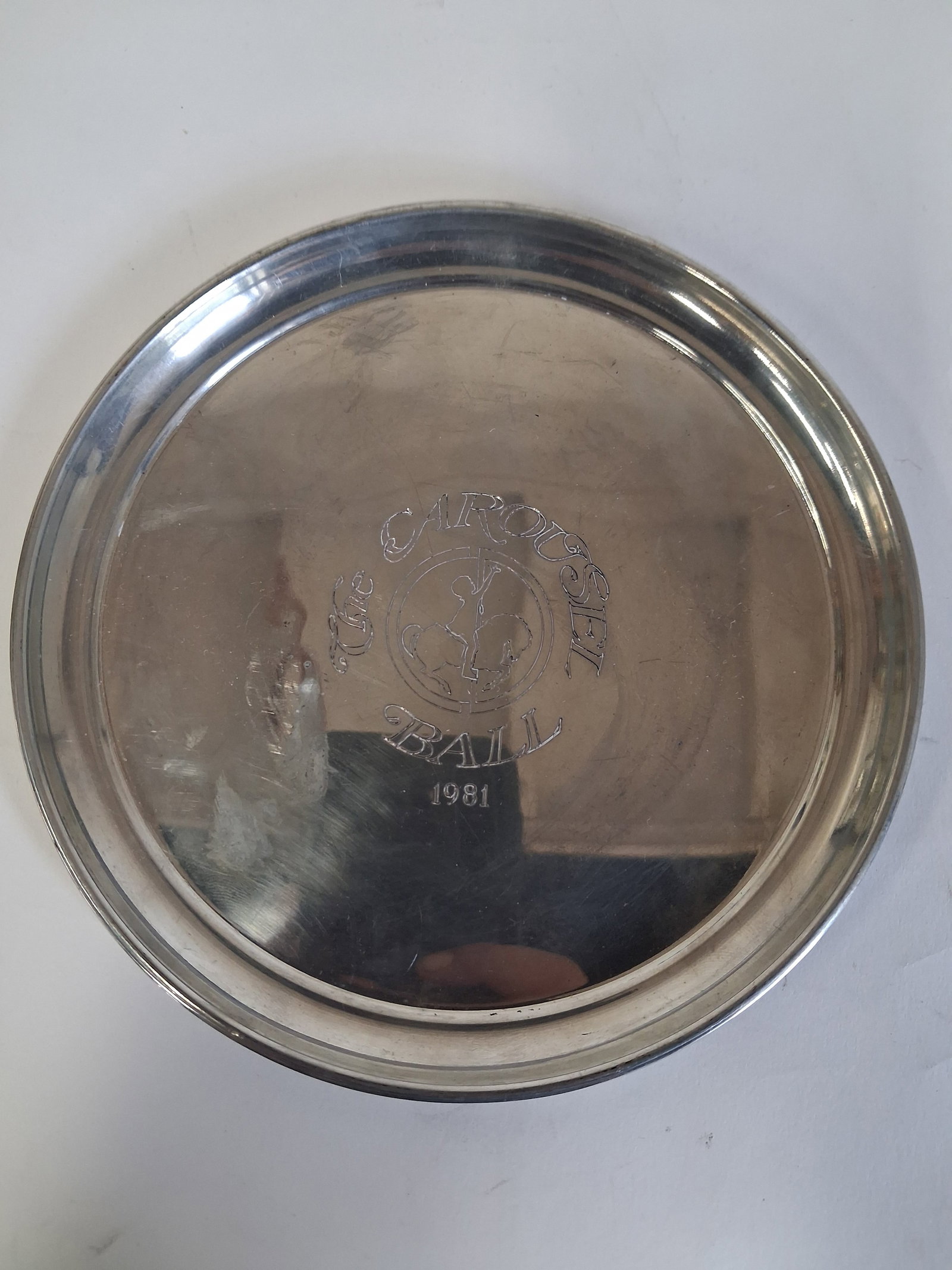 Cartier Pewter Plate 1981: The Carousel Ball 1981 engraved at front. Marked Cartier at the underside..7"W