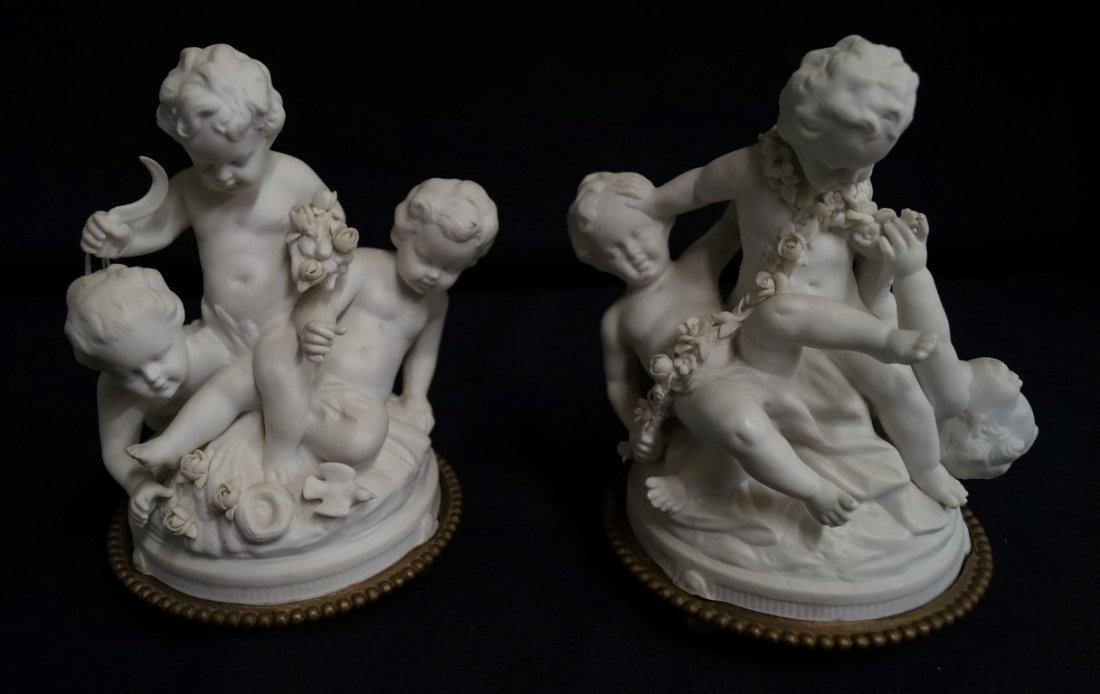 Pair of 19th C. Parian Figures: Cherubs at play. On ornate bases. 7"H.