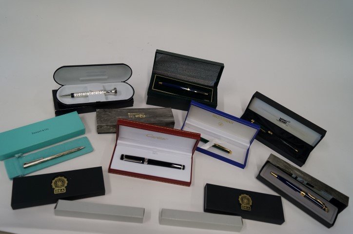 Collectible Pens inc. Tiffany & Cartier: A lot of 12 collectible fountain pens, all mint. Included in the lot is a Tiffany sterling ; a Mont Blanc; a Cartier; a Waterman; a blue Cross; a Bonetto (with watch); two from the police of Ireland; 