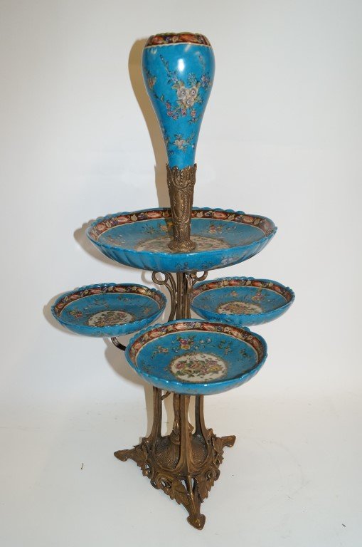 Art Nouveau Bronze & Porcelain Epergne: Art nouveau bronze woman in central area of the ornate bronze base gives rise to four enameled paint decorted servers with a vase at the top 30"H.