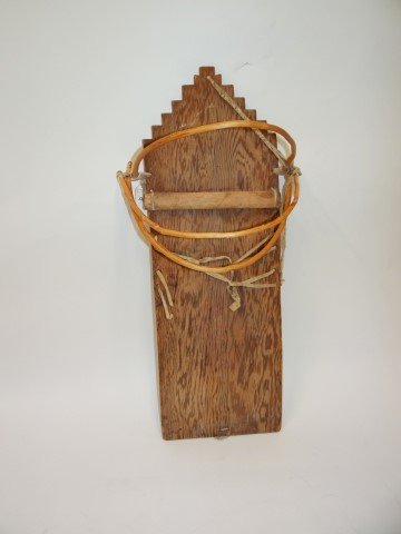 American Indian cradle board: Hand made wooden cradle board. Pueblo design; 29in. H. x 13in. W.