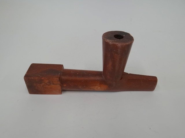 American Indian steatite pipe: Carved and polished steatite pipe; 3.5in. H. x 7.25in. W.