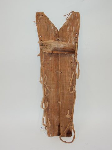 American Indian cradle board: Early cradle board; 27in. H. x 8.5in. W.