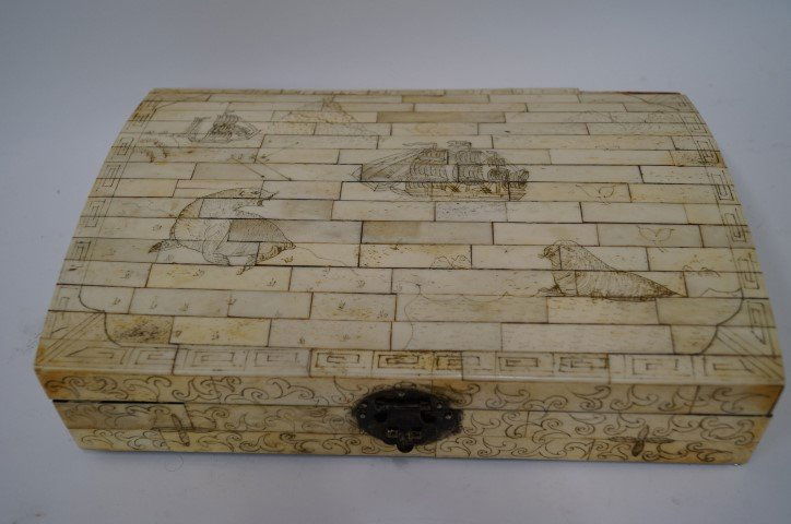 Ivory Nautical Themed Box: Scrimshawed with clipper ship, marine animals etc. Lacquered wooden interior. Made of srimshawed panels 2 3/4"H. x 12" L. x 8 1/2" W.
