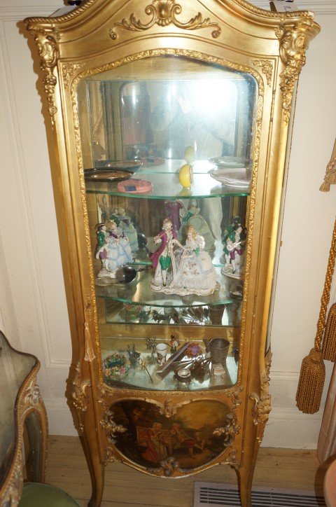 Vernet Martin French Vitrine.: Curved glass. Mirror back. Glass Shelves. Hand painted classical scene at the bottom. Some minor gilt loss. 70"H. x 22"W.