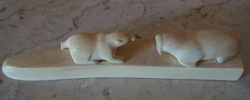 Ivory Carving. Polar Bear and Walrus: Polar Bear "confronts" a walrus in this ivory carving 2"H. x 10"L