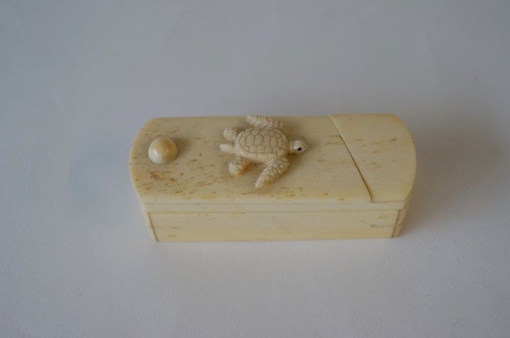 Ivory Puzzle Box: Turtle mounted at the top and scrimshawed turtle at the inside. 3 1/4"L.