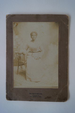 Cabinet Card.Black Woman. C. 1900: Julia Curry photographed by Simpson Photographer of Ft. Worth, Texas. Written on the reverse is Julia Curry, My Grandmother (Mittie) 5" x 7"