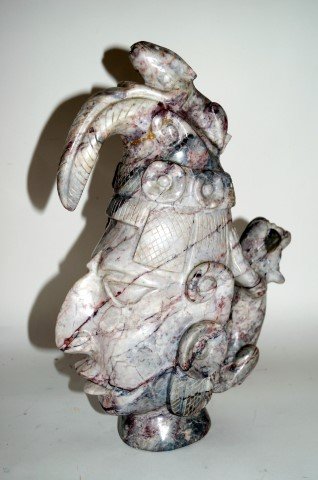 Mayan Hardstone Head of a Warrior: Carved hardstone head of a warrior with animal fetish; 13.5in.