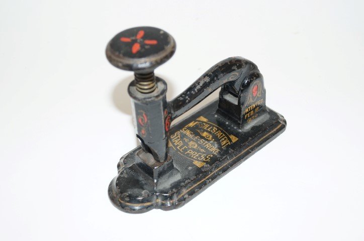 Victorian Cast Iron Staple Press: McGill's Patent Single Stroke Staple Press. Cast Iron with painted graphics 6 1/4"L. 5"H.