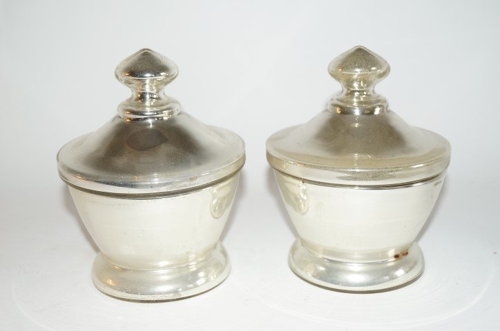Pair of Mercury Glass Covered Apothecary Jars: Pair of mercury glass covered apothecary jars. Corked pontils; 6.5in. H. x 5in. D.