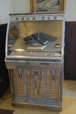 Rock Ola Jukebox: 120 Hi-Fi selections. "One play - Two nickels or a dime" - "Three plays - a quarter" 30x57x25"( needs minor repair)