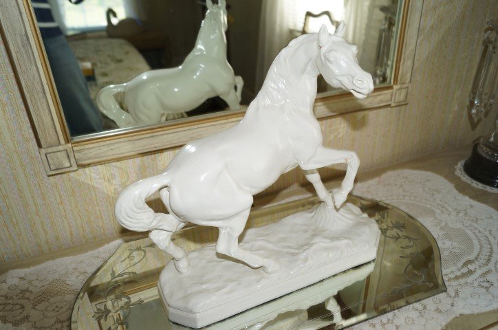 Painted Plaster Figure of a Stallion: Painted plaster stallion; 14.5in.H. X 14.5in. W.