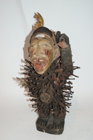 Carved African Nail Figure: Carved African nail figure with painted decorations and with spear; 21in. H.