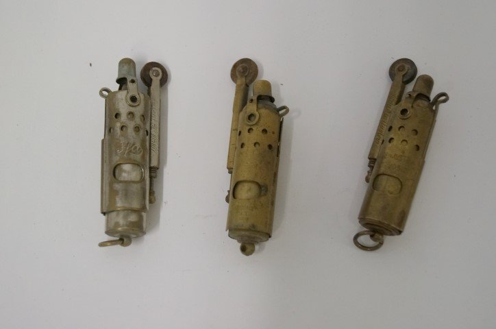 Three Unusual Lighters: Two marked YFA, made in Austria and with pattent numbers and one marked Negbour NY Japan - Brass and chrome. 2 3/4"h