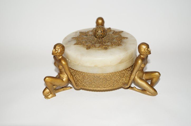 French Art Deco Bronzed and Alabaster Figural Dresser: Dore bronzed figural mounted alabaster dresser box. Three(3) nude women support the circular covered box. Mounted with bronzed filigreed trim; 5.5in. H. X 8.5in. W.