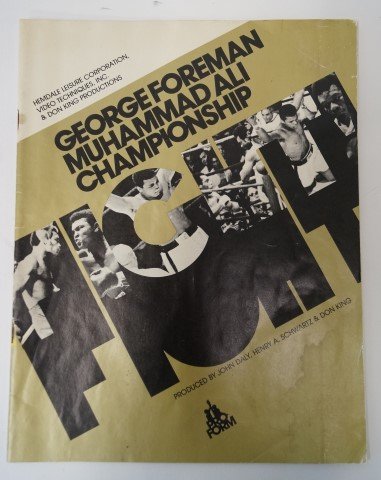 Foreman-Ali Fight Program-Zaire: George Foreman Muhammad Ali Championship Program. With color photos, unused score card, Budweiser advertisement, back cover for your seat "Occupied, Gone for more cold Bud…Be right back" 48 pgs with